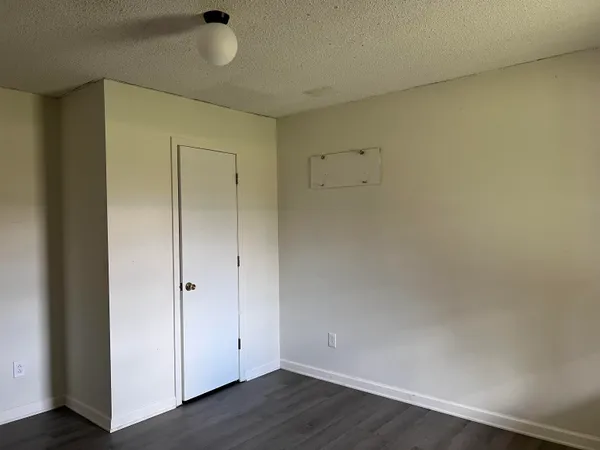 a view of field with trees in the background