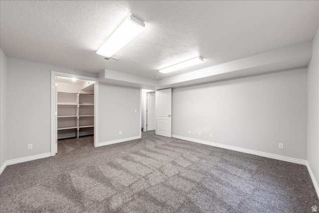7 Reflection Way St. George, UT 84770 - Photo 27 of 54 Finished below grade area featuring a textured ceiling and carpet floors