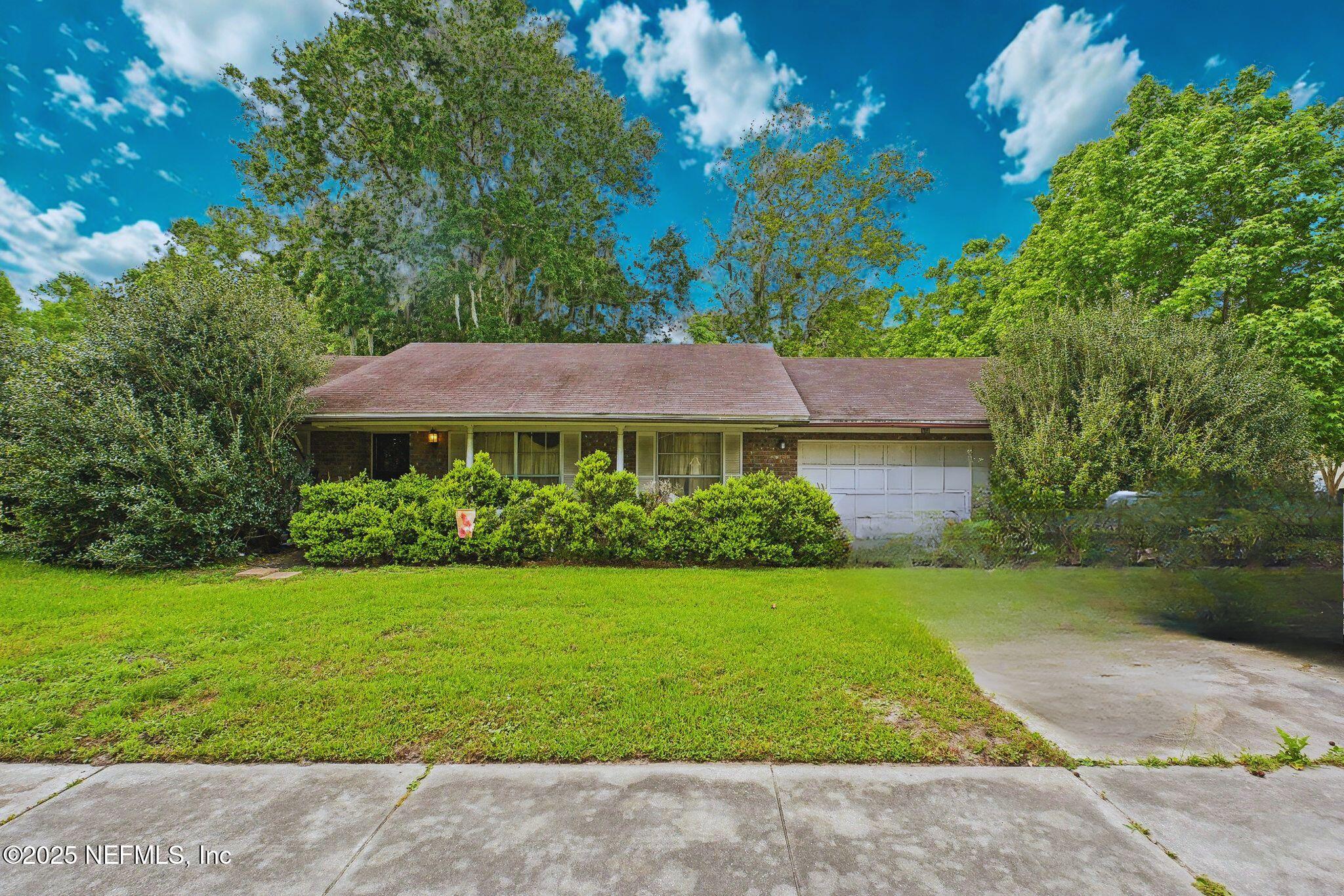 6695 Arrowroot Drive Jacksonville, FL 32244 - Photo 2 of 2 a view of a house with garden