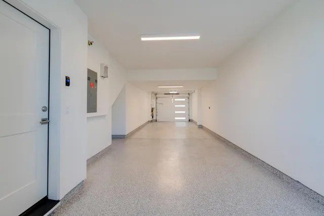 an aerial view of a residential houses with city view