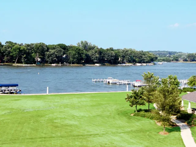 a view of a lake with houses in background