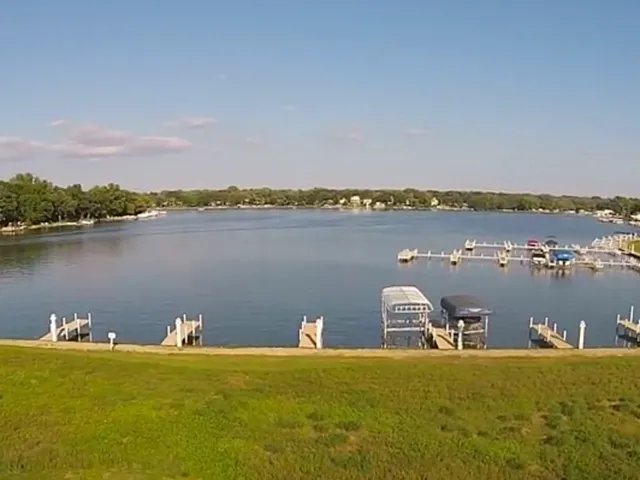 a view of a city with lake view and houses in the back