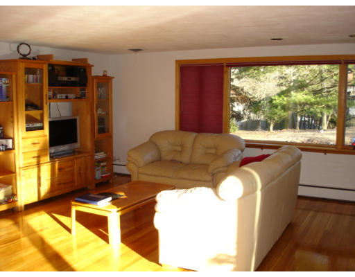25 Squire Road Winchester, MA 01890 - Photo 1 of 12 a living room with furniture a large window with kitchen view