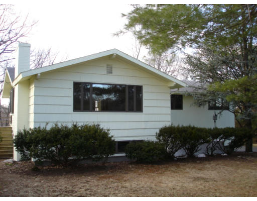 25 Squire Road Winchester, MA 01890 - Photo 3 of 12 a front view of a house with a yard