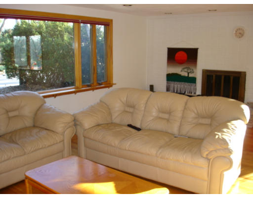 25 Squire Road Winchester, MA 01890 - Photo 7 of 12 a living room with a large bed and a couch