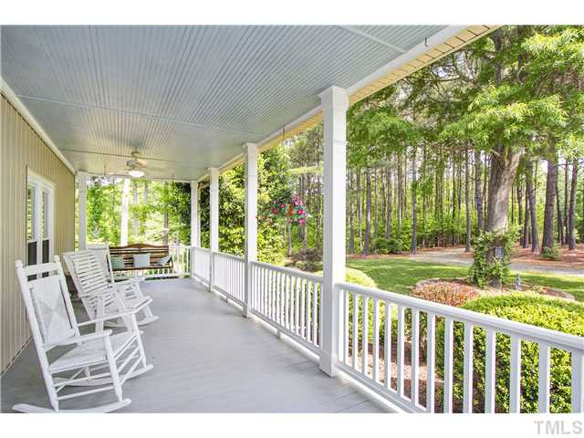 10117 Hampton Road Rougemont, NC 27572 - Photo 4 of 25 Large rocking chair front porch to overlook the well manicured landscaping! Porch