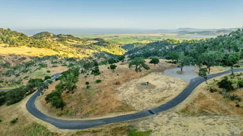 a view of a wooden floor with a view of lake