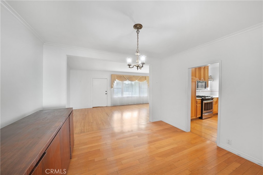 3837 Mountain View Avenue Pasadena, CA 91107 - Photo 13 of 41 a view of an empty room with window and chandelier