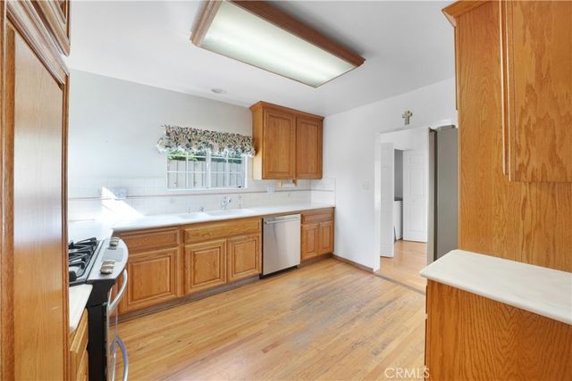 a large bathroom with a sink mirror and a bath tub
