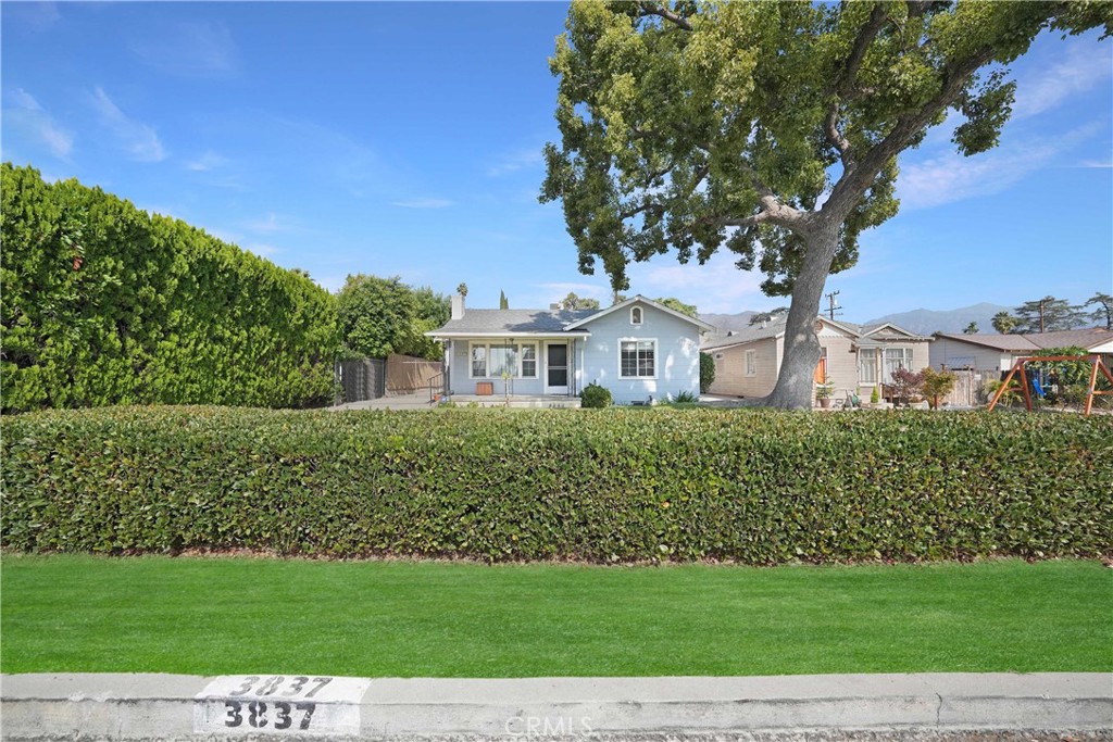 3837 Mountain View Avenue Pasadena, CA 91107 - Photo 2 of 41 a front view of a house with a garden
