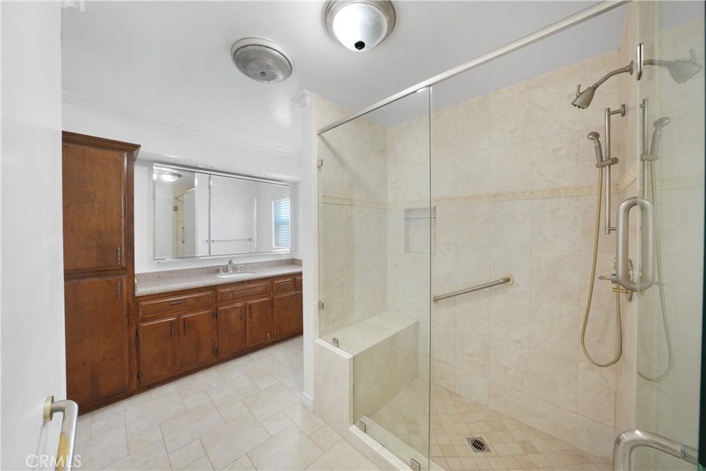 3837 Mountain View Avenue Pasadena, CA 91107 - Photo 10 of 41 a bathroom with a granite countertop shower sink vanity and mirror