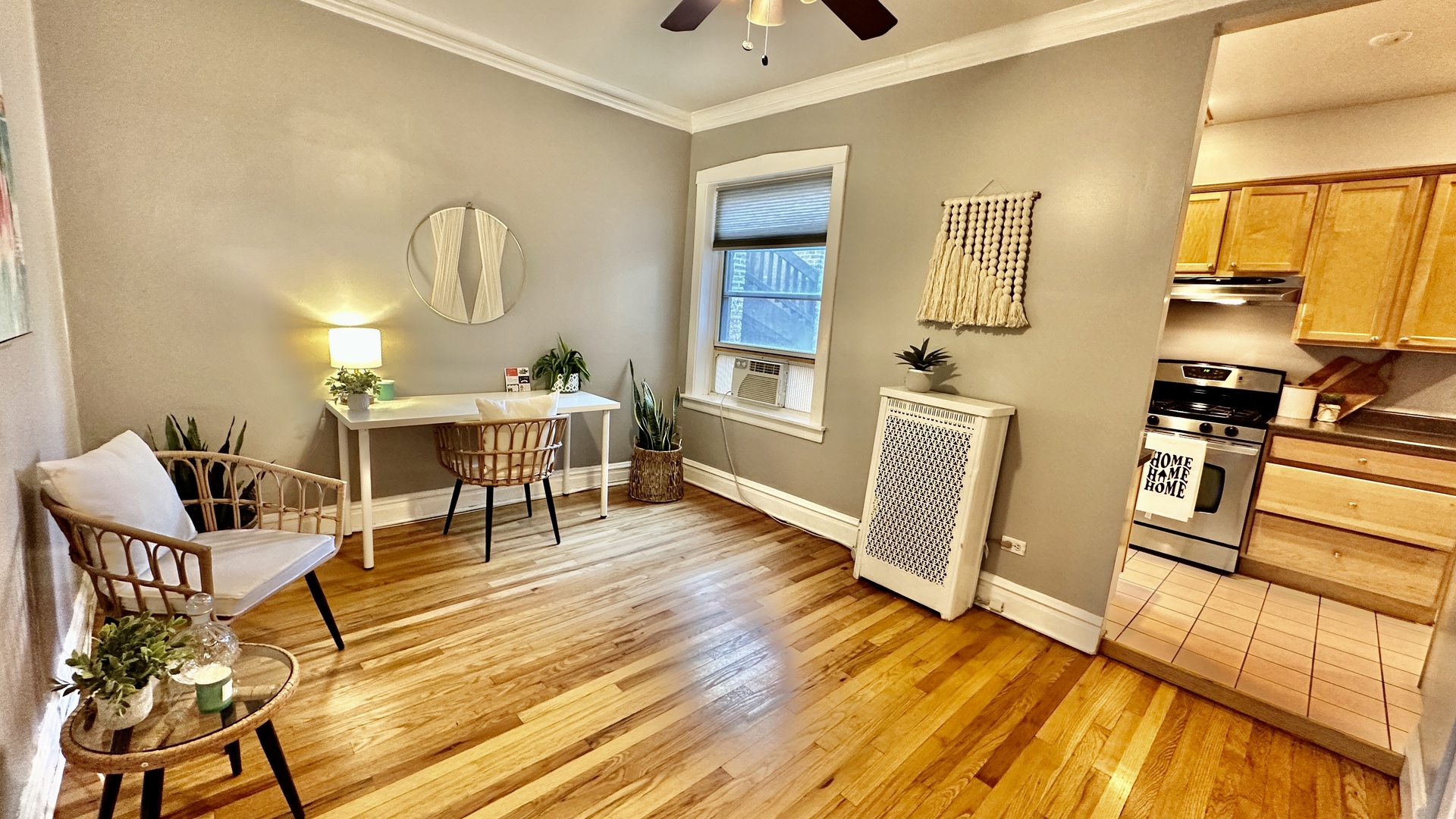 1319 West Addison Street, Unit 1A Chicago, IL 60613 - Photo 11 of 20 a living room with furniture a fireplace and wooden floor