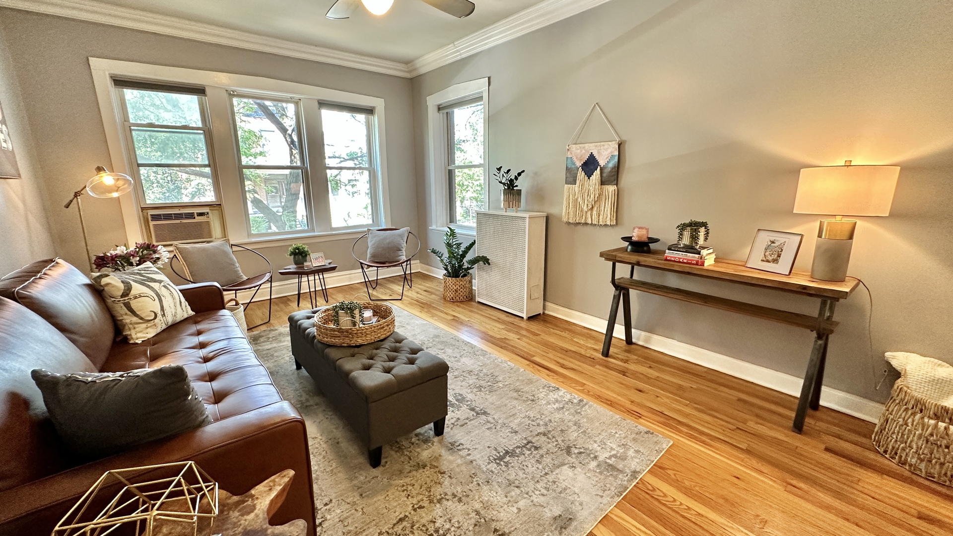 1319 West Addison Street, Unit 1A Chicago, IL 60613 - Photo 2 of 20 a living room with furniture and a window