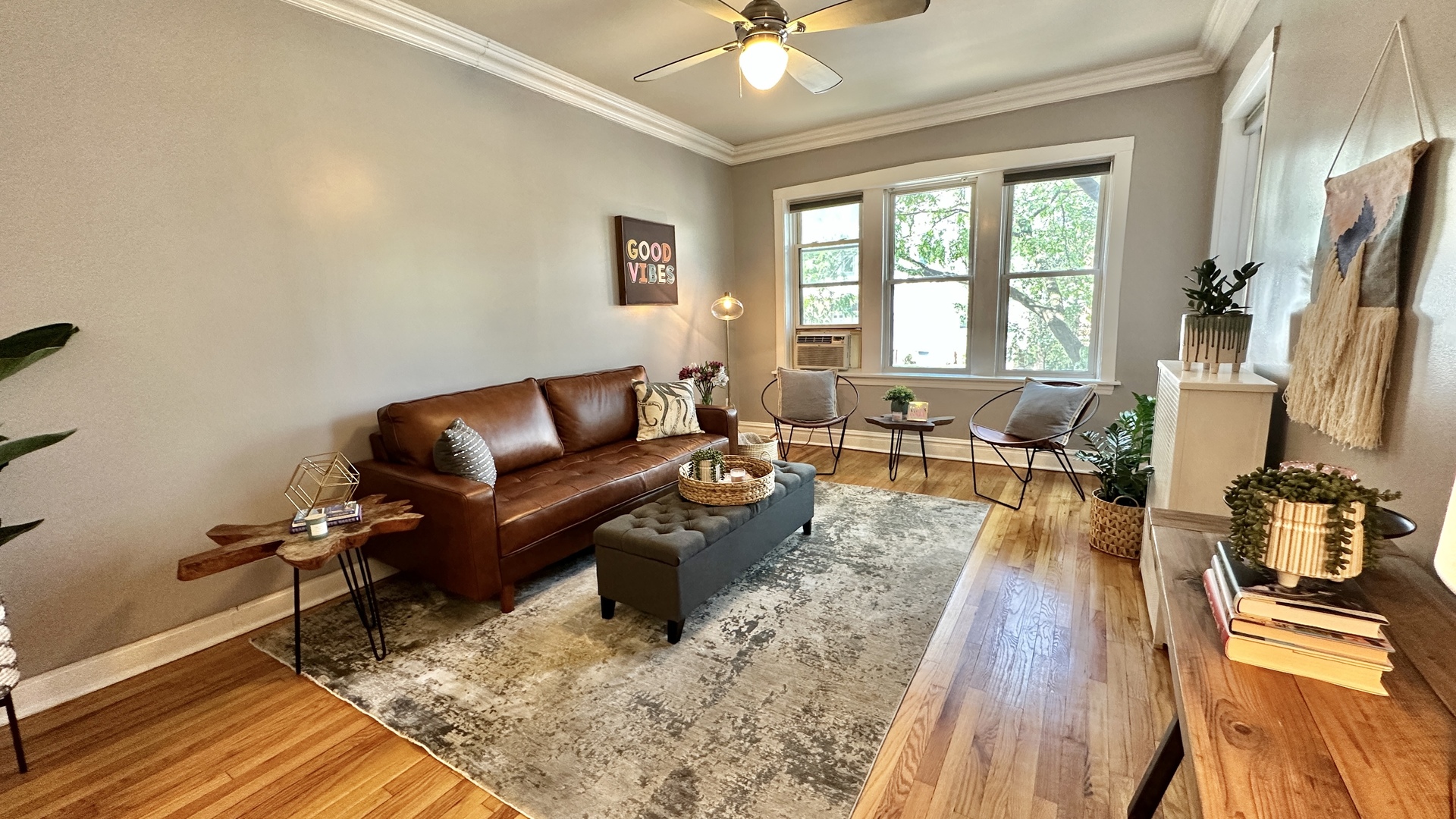 1319 West Addison Street, Unit 1A Chicago, IL 60613 - Photo 5 of 20 a living room with furniture and a large window