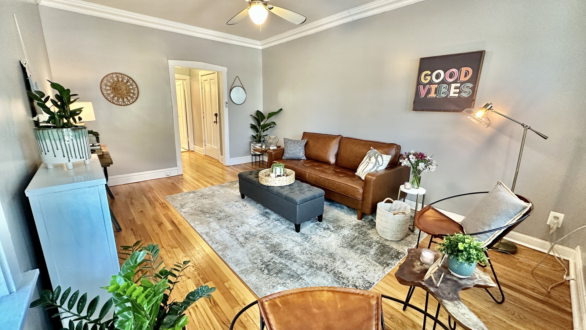 1319 West Addison Street, Unit 1A Chicago, IL 60613 - Photo 6 of 20 a living room with patio furniture and a wooden floor