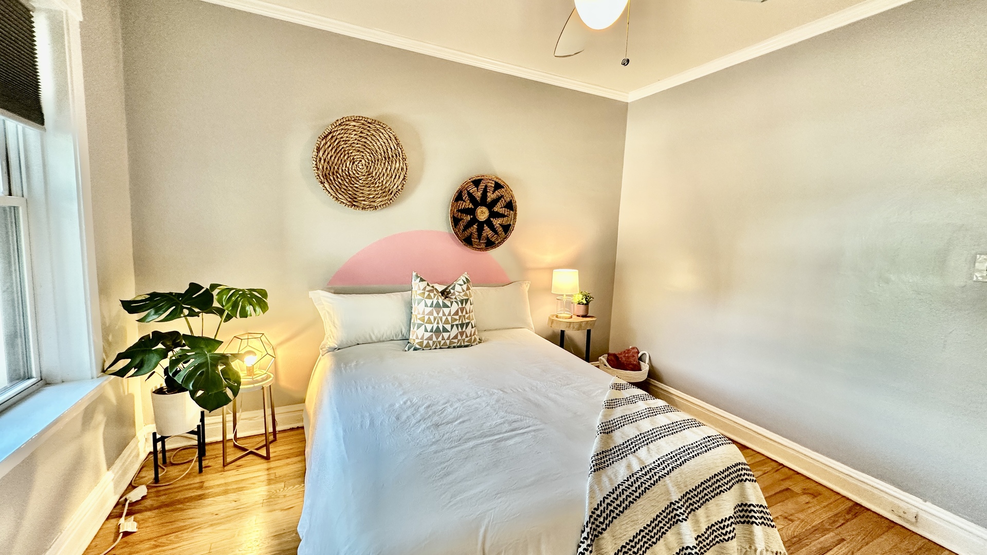 1319 West Addison Street, Unit 1A Chicago, IL 60613 - Photo 8 of 20 a bedroom with a bed and a potted plant