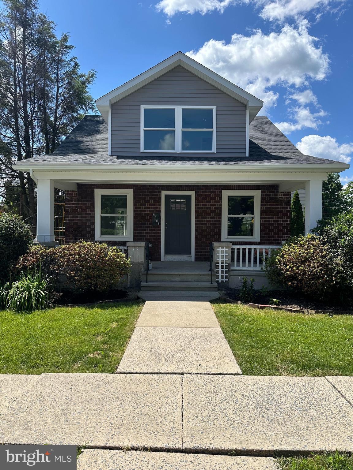 a front view of a house with yard