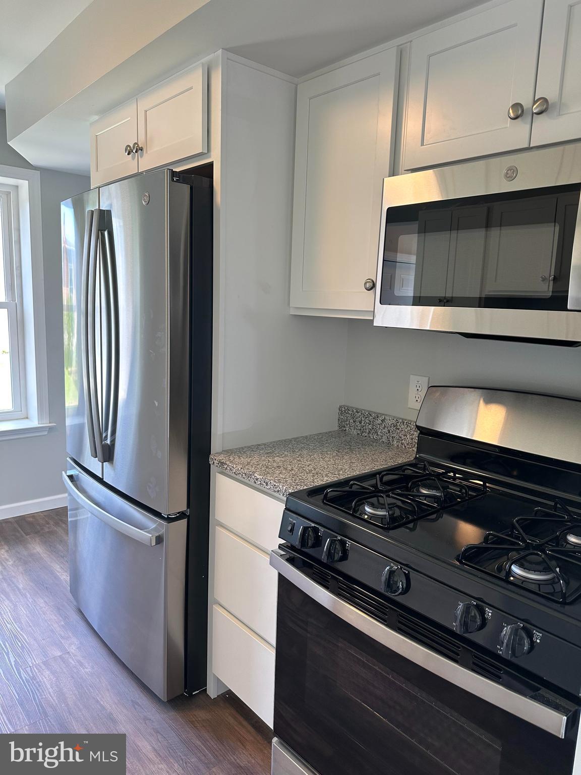 2102 Reading Avenue West Lawn, PA 19609 - Photo 11 of 17 a kitchen with a stove and a microwave
