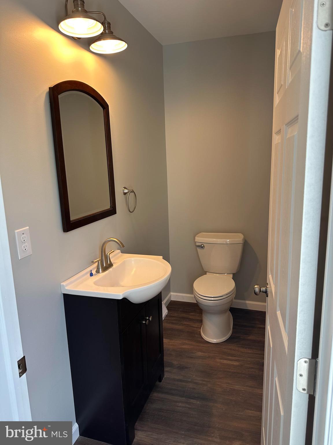 2102 Reading Avenue West Lawn, PA 19609 - Photo 13 of 17 a bathroom with a toilet sink and mirror