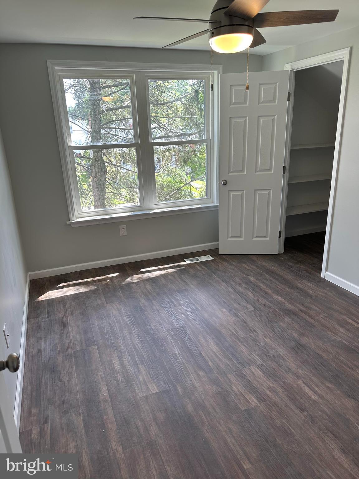 2102 Reading Avenue West Lawn, PA 19609 - Photo 15 of 17 an empty room with wooden floor and windows