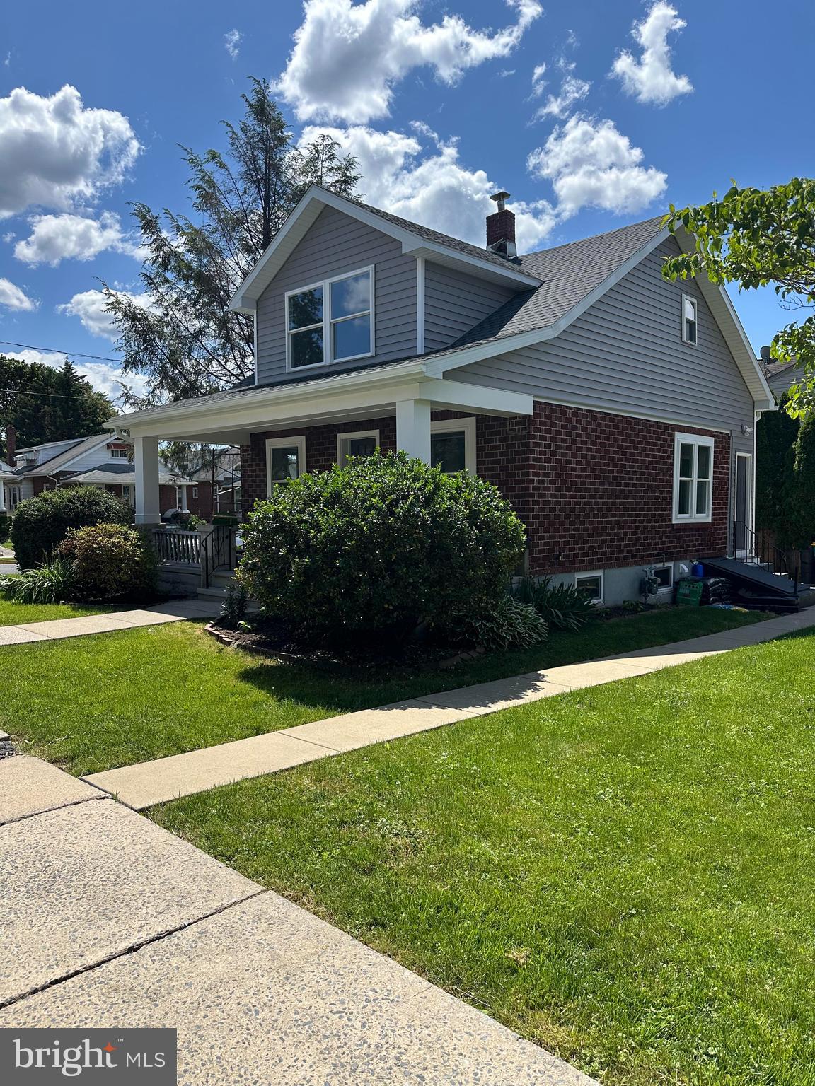 2102 Reading Avenue West Lawn, PA 19609 - Photo 2 of 17 a front view of a house with a garden