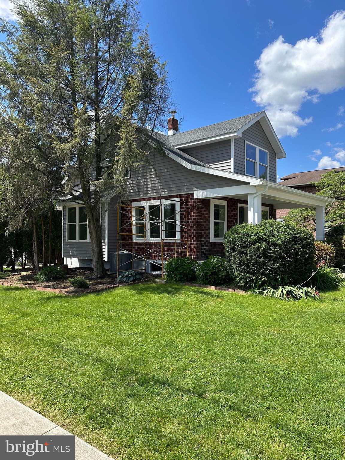 2102 Reading Avenue West Lawn, PA 19609 - Photo 3 of 17 a front view of a house with a garden