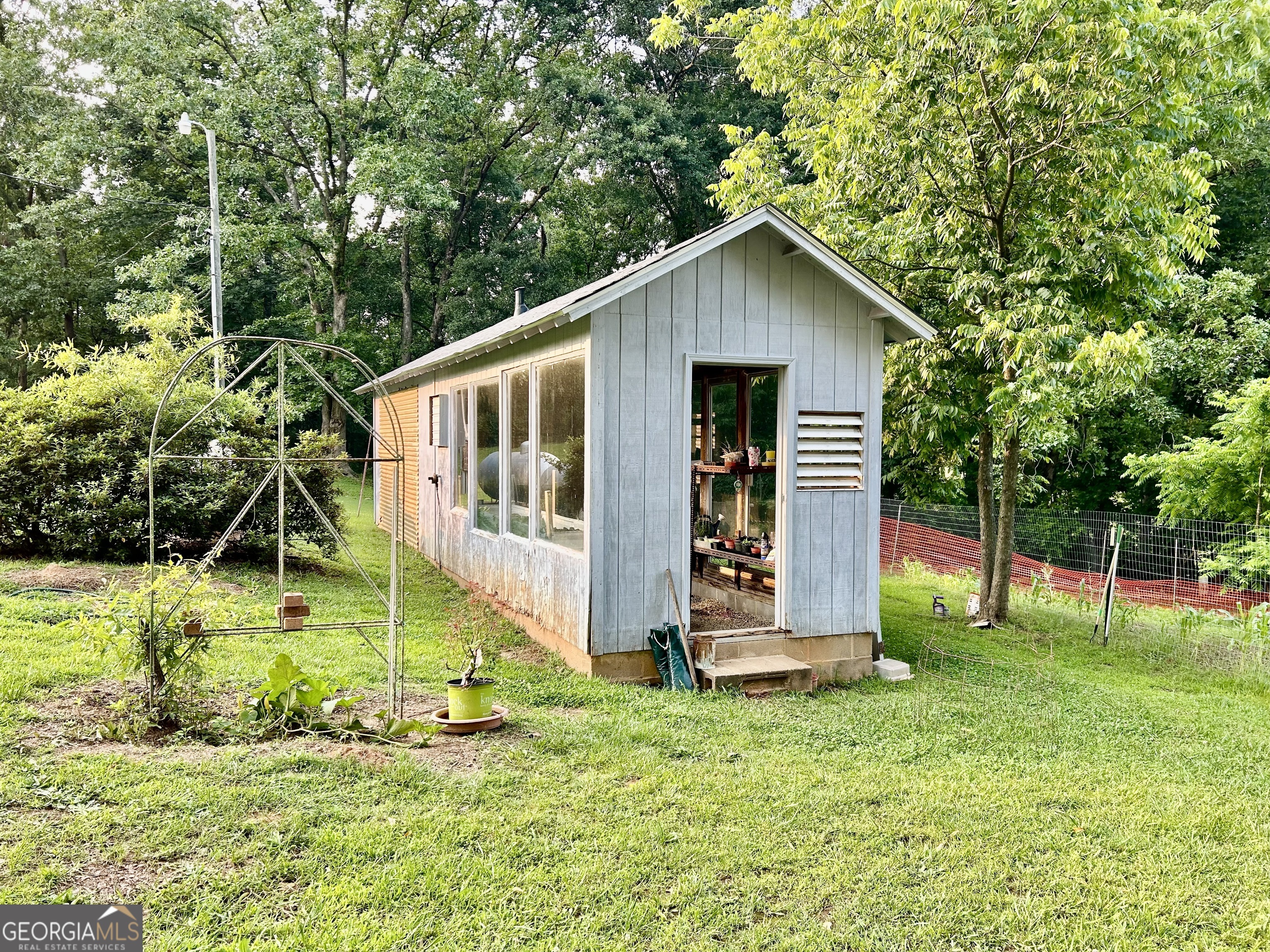 3272 Horace Road Bowman, GA 30624 - Photo 14 of 40 a view of a house with backyard and garden