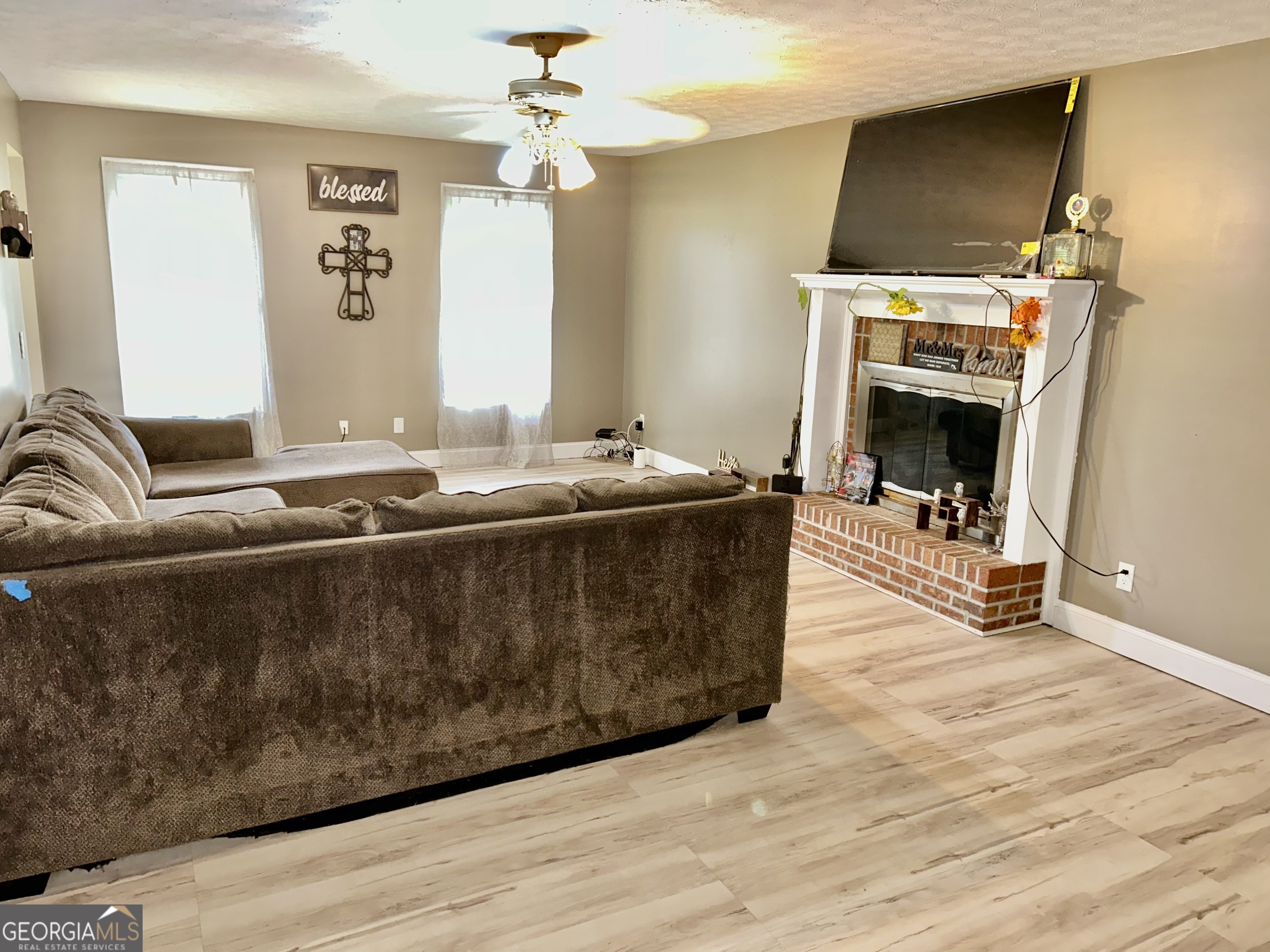 3272 Horace Road Bowman, GA 30624 - Photo 17 of 40 a living room with furniture and a fireplace