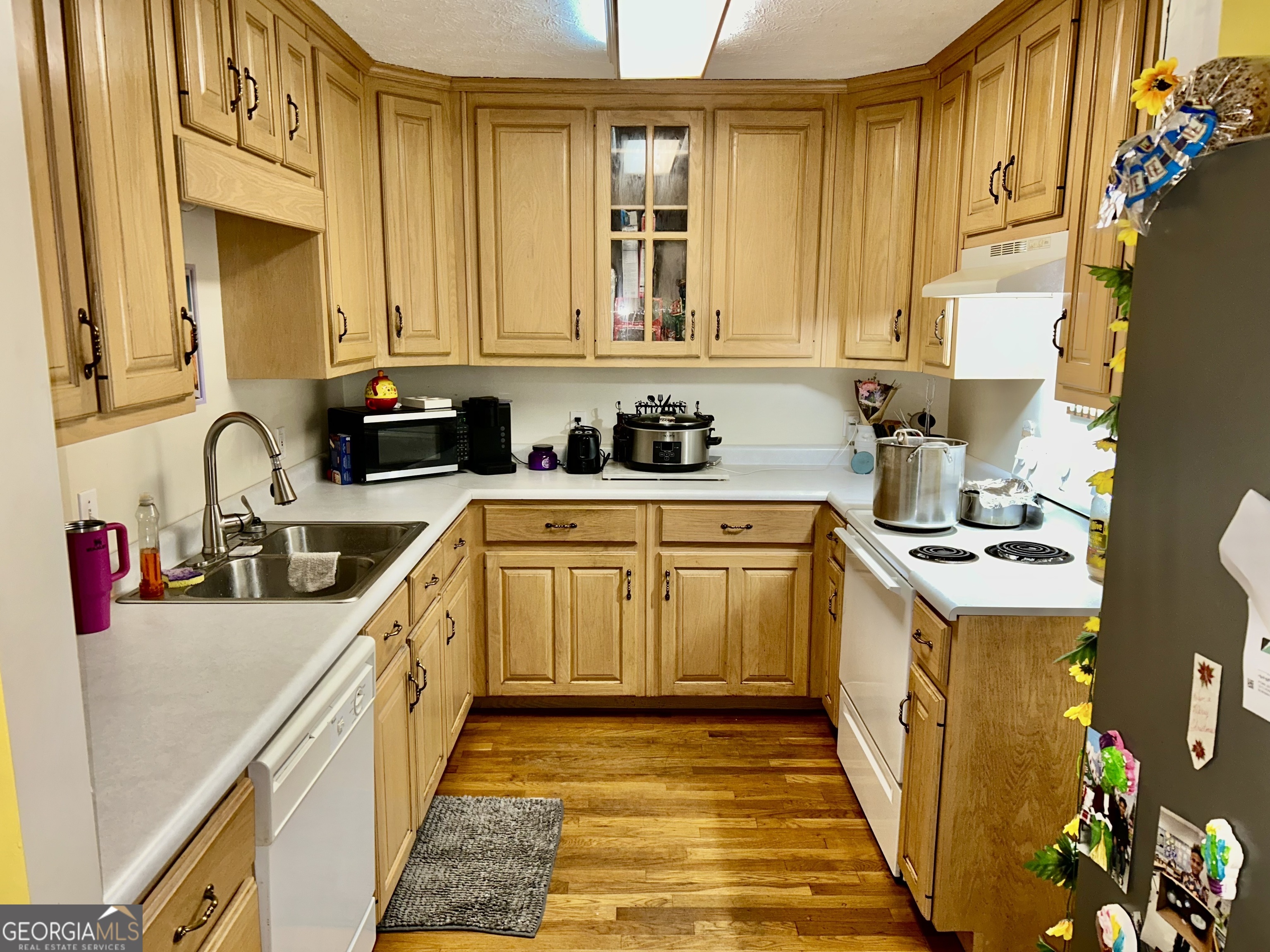 3272 Horace Road Bowman, GA 30624 - Photo 20 of 40 a kitchen with a sink a stove and cabinets