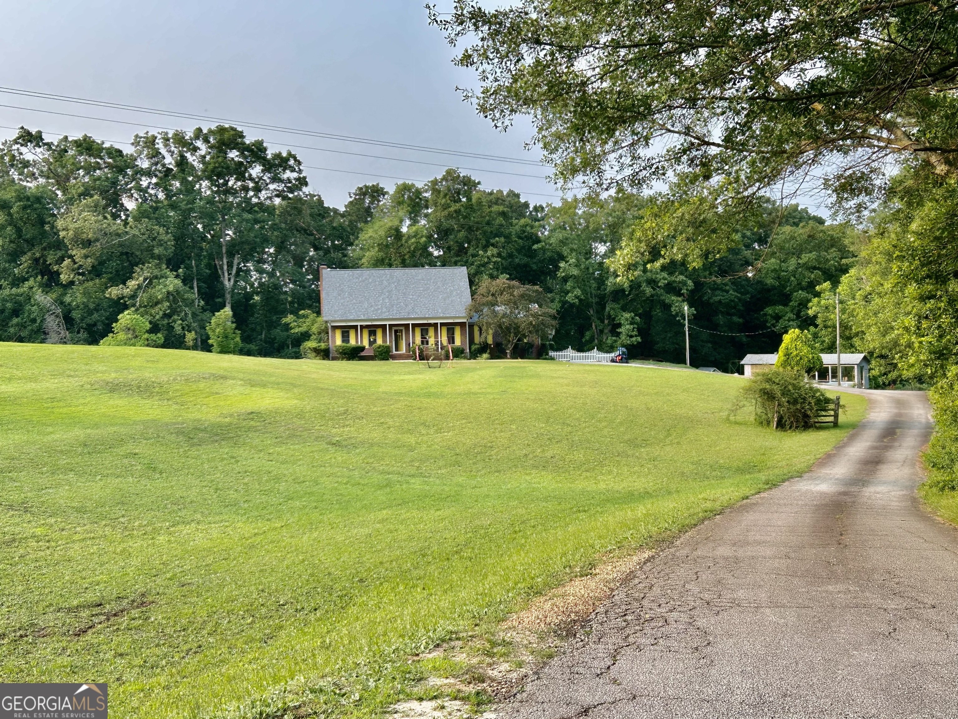 3272 Horace Road Bowman, GA 30624 - Photo 2 of 40 a view of a street with a garden