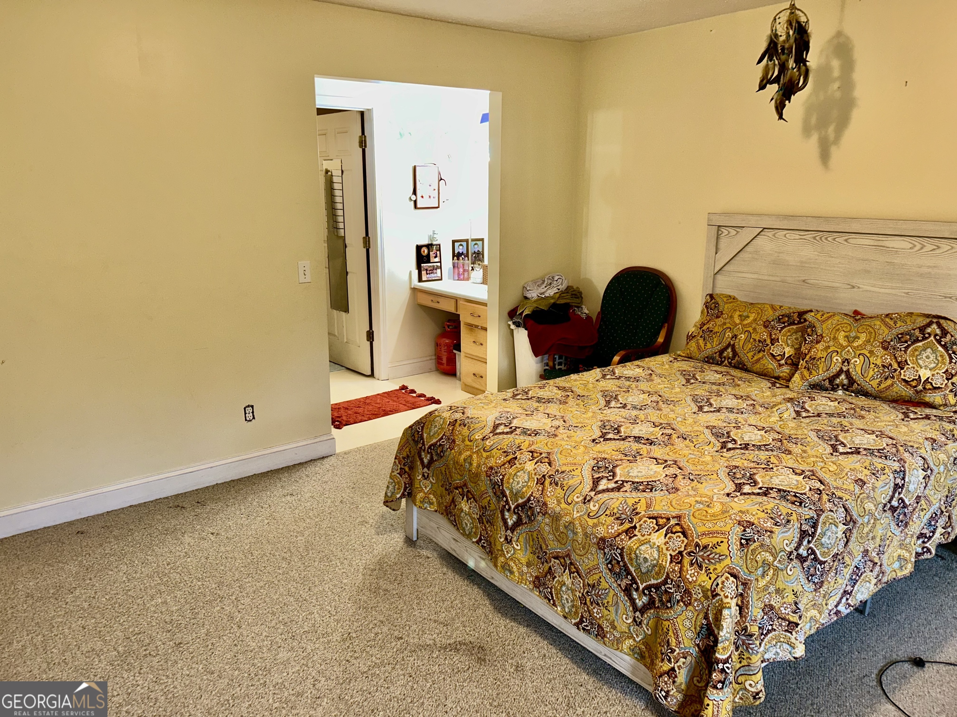 3272 Horace Road Bowman, GA 30624 - Photo 21 of 40 a bed sitting in a bedroom next to a bathroom