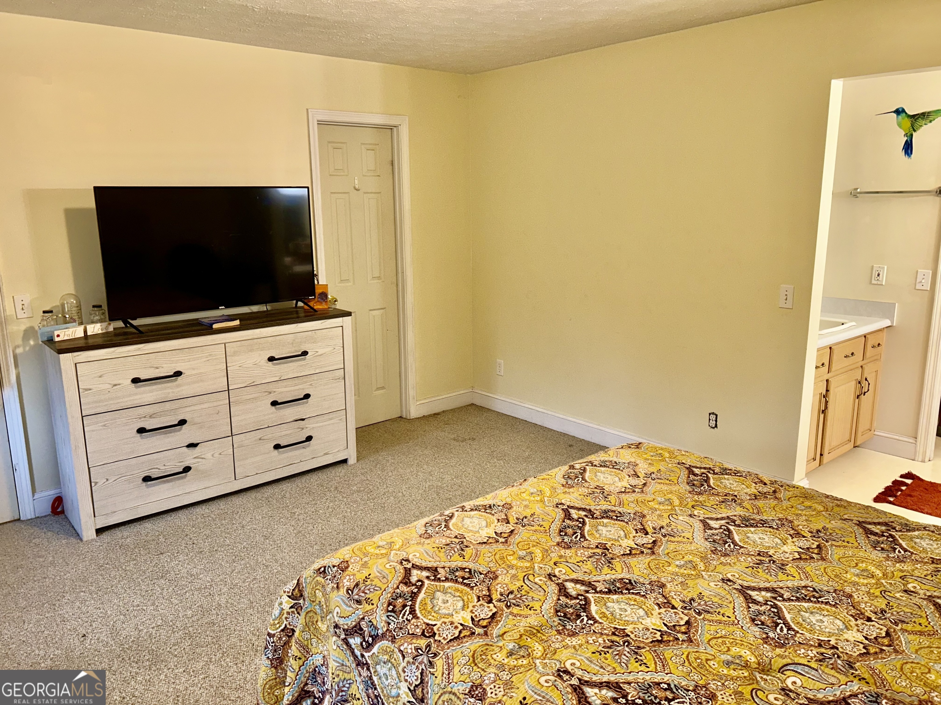 3272 Horace Road Bowman, GA 30624 - Photo 22 of 40 a bedroom with a bed and flat screen tv