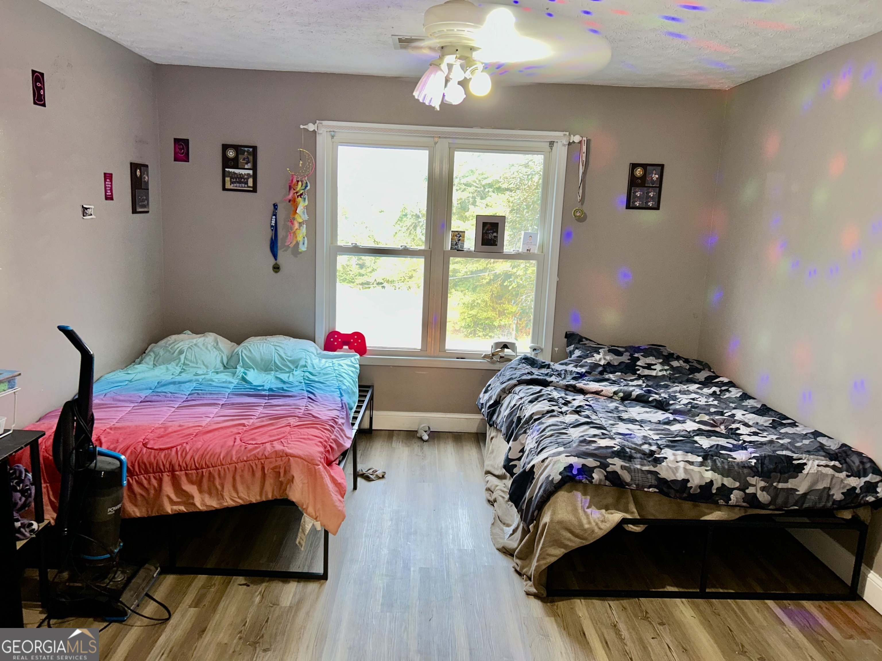 3272 Horace Road Bowman, GA 30624 - Photo 29 of 40 a bed sitting in a bedroom next to a window