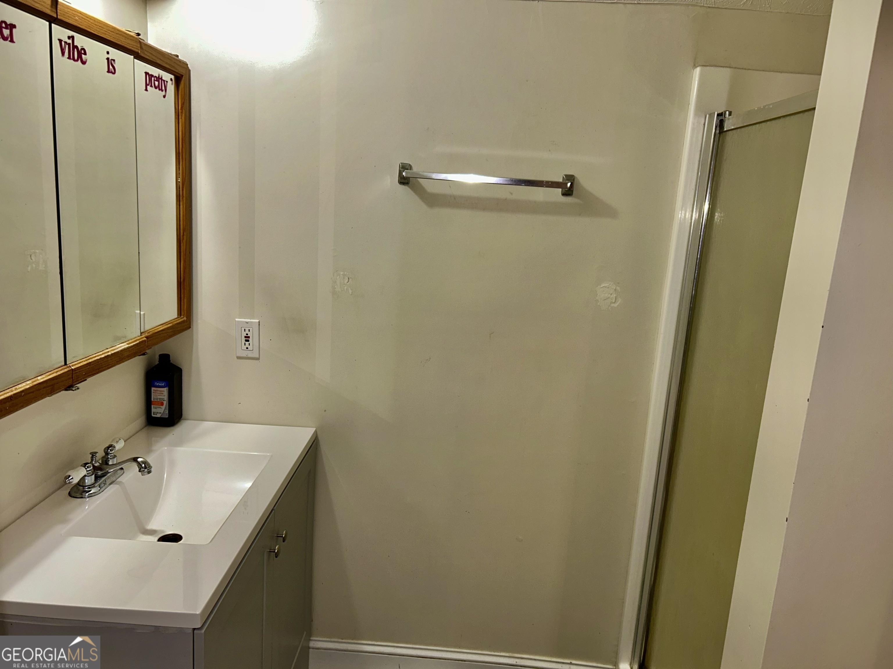 3272 Horace Road Bowman, GA 30624 - Photo 31 of 40 a bathroom with a sink and a mirror