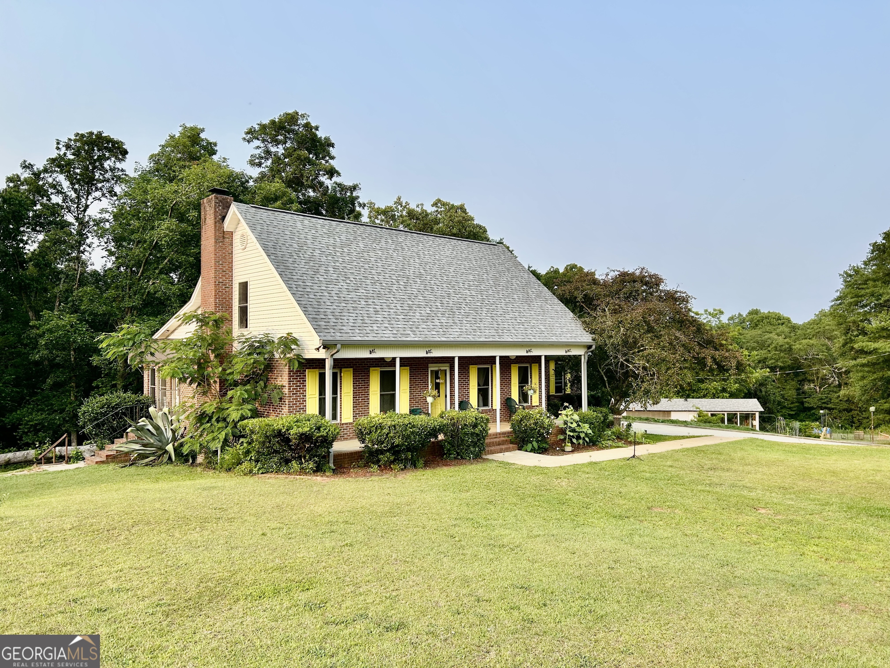 3272 Horace Road Bowman, GA 30624 - Photo 5 of 40 a front view of house with yard and lake view