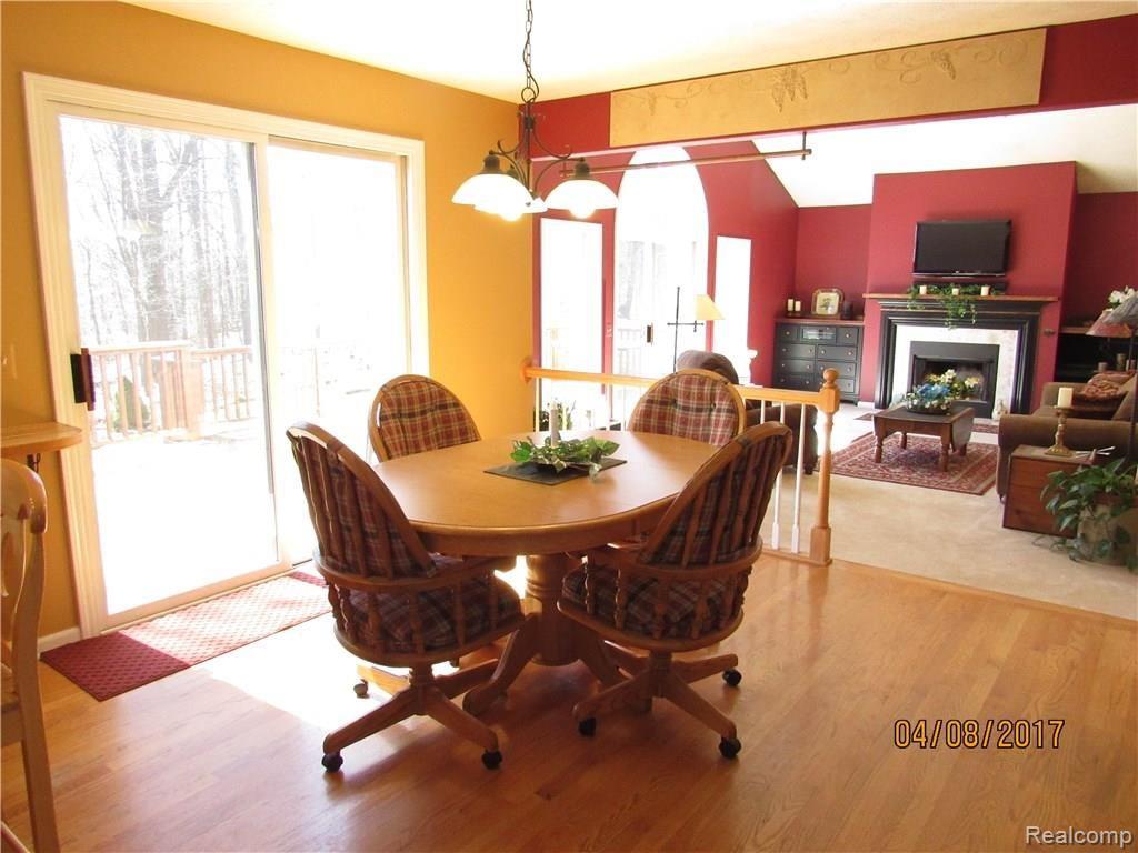 1212 Elk Run Howell, MI 48843 - Photo 13 of 32 Bright and sunny eat in kitchen w hardwood floors.