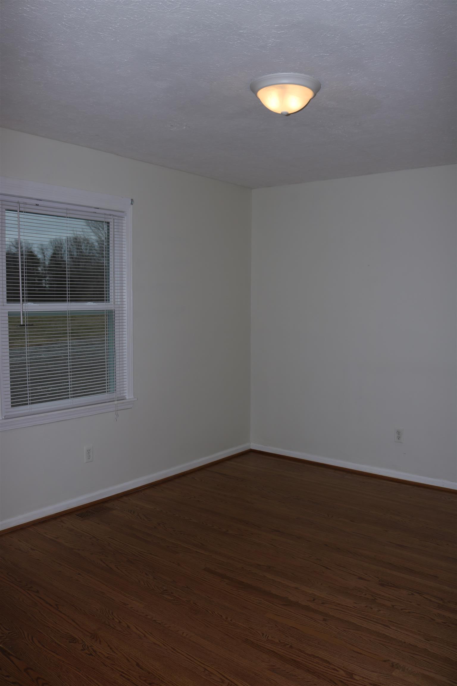 3963 Calista Road Cross Plains, TN 37049 - Photo 12 of 27 Third bedroom is also a good size with beautiful hardwoods.