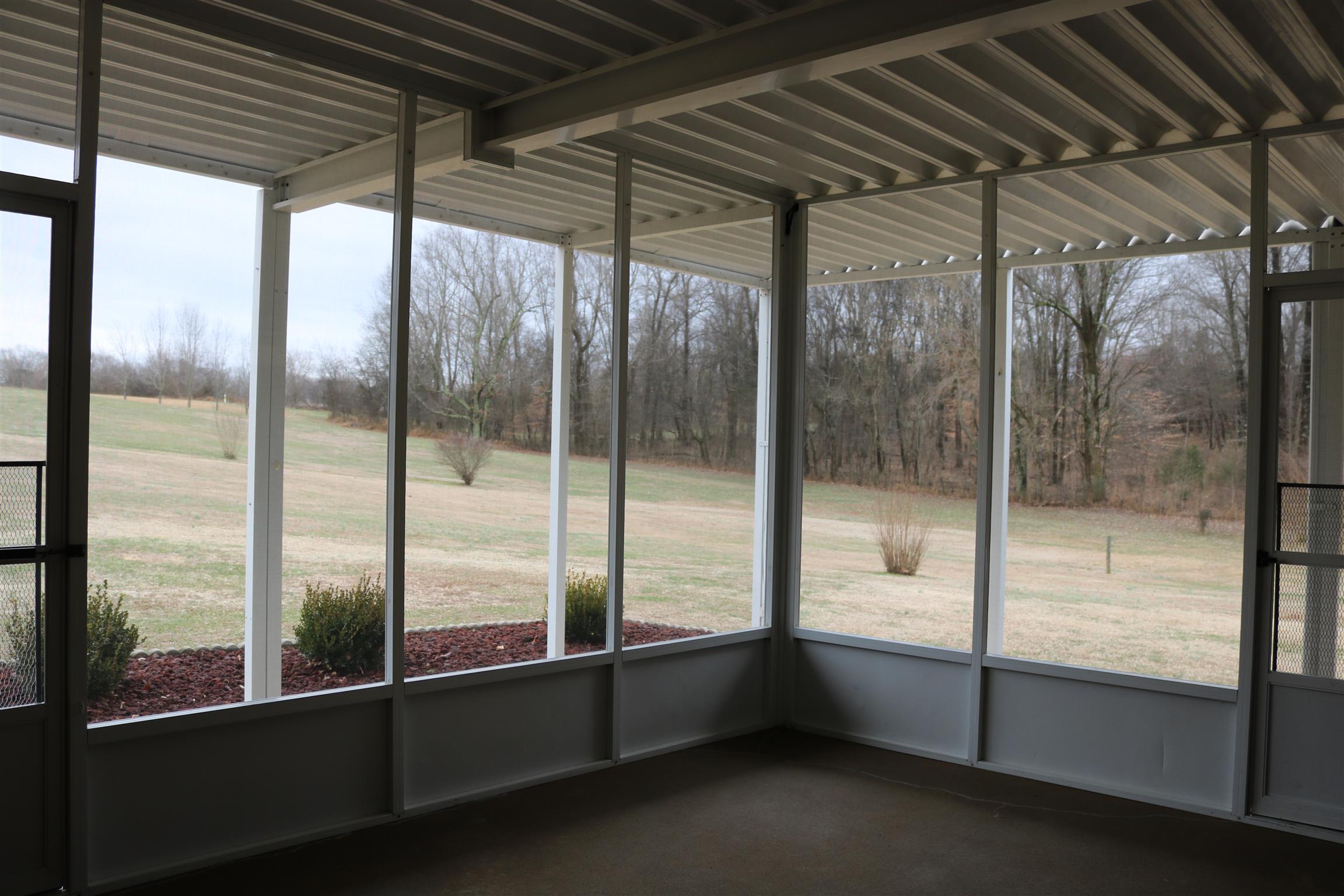 3963 Calista Road Cross Plains, TN 37049 - Photo 14 of 27 Awesome screened in patio is great for relaxing and enjoying the view of the outdoors.