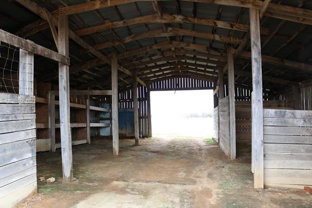 3963 Calista Road Cross Plains, TN 37049 - Photo 20 of 27 Inside the large barn with plenty of horse stalls.