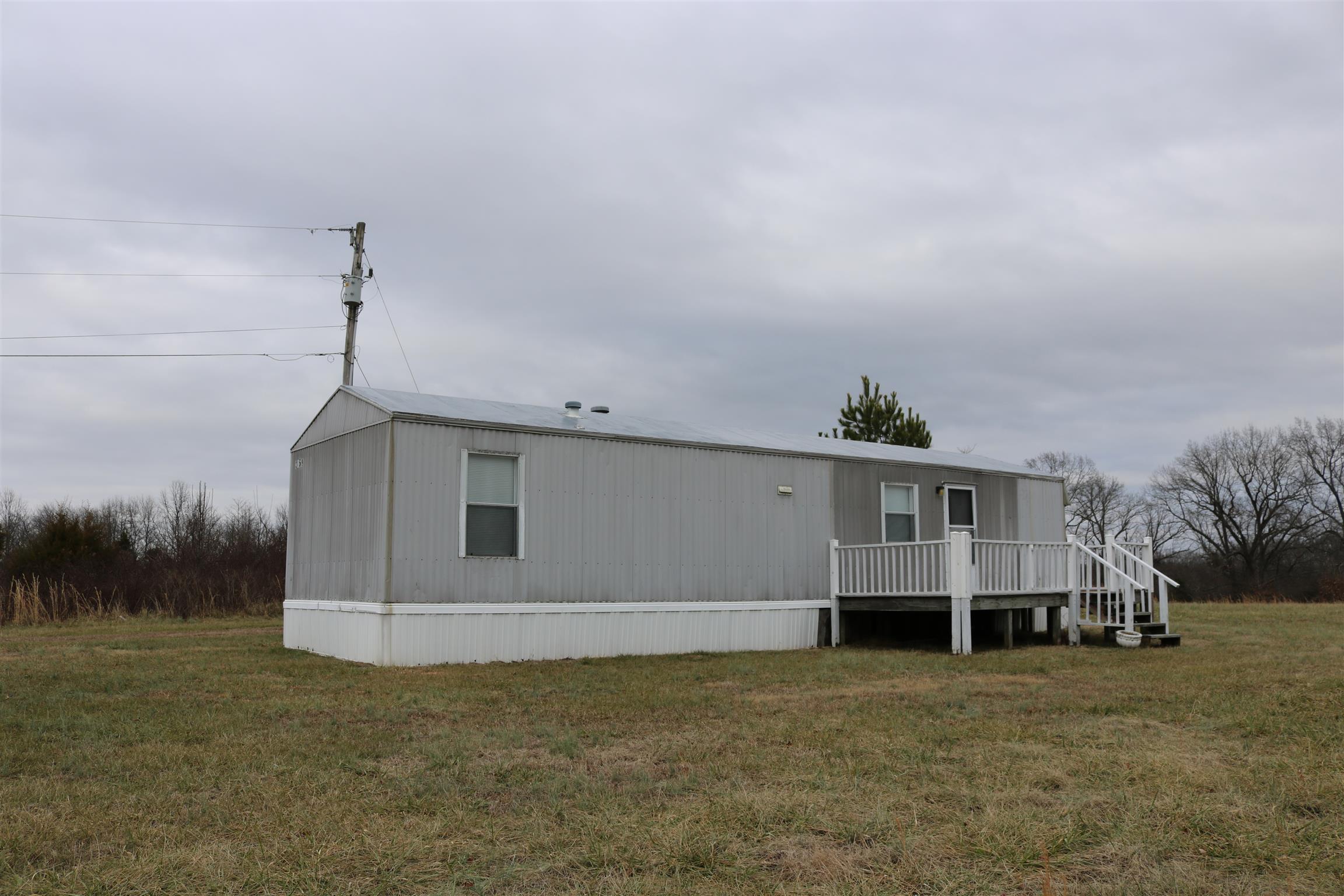 3963 Calista Road Cross Plains, TN 37049 - Photo 21 of 27 This well kept trailer is set far back on the property and has its own driveway. Use this however you'd like, even renting it out for extra income.
