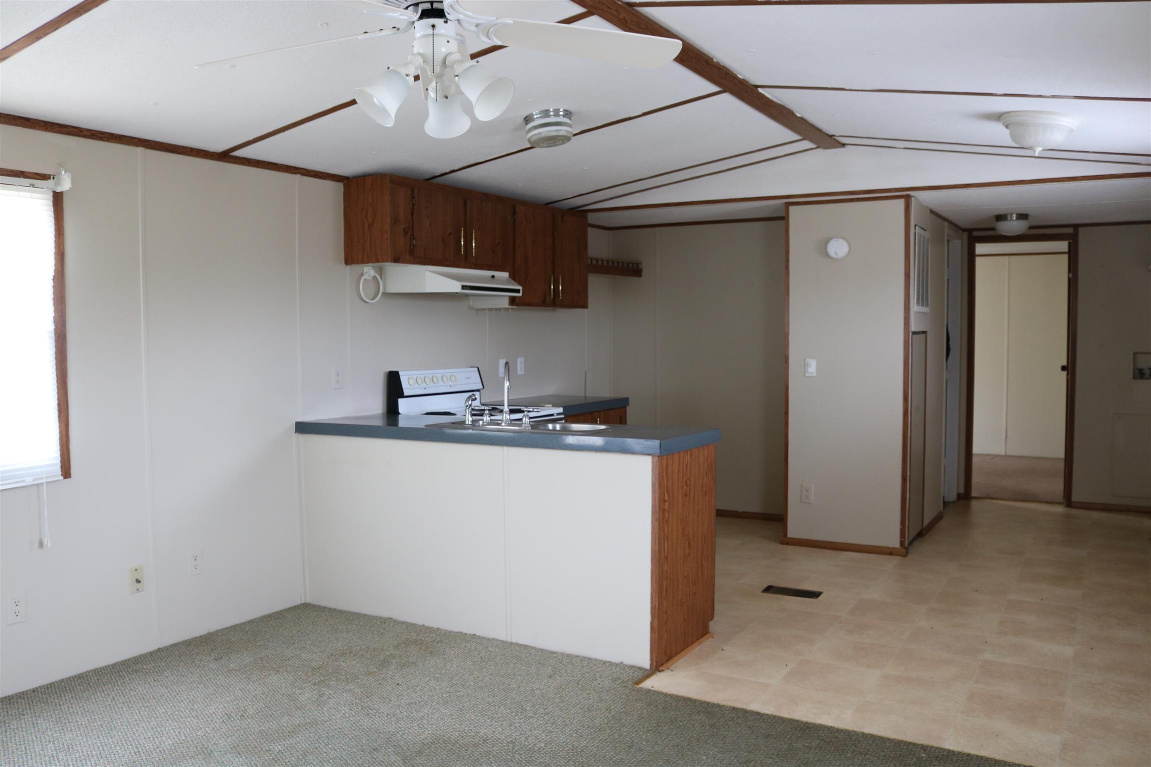 3963 Calista Road Cross Plains, TN 37049 - Photo 22 of 27 Living room and dining room area within the two bedroom one bathroom trailer.