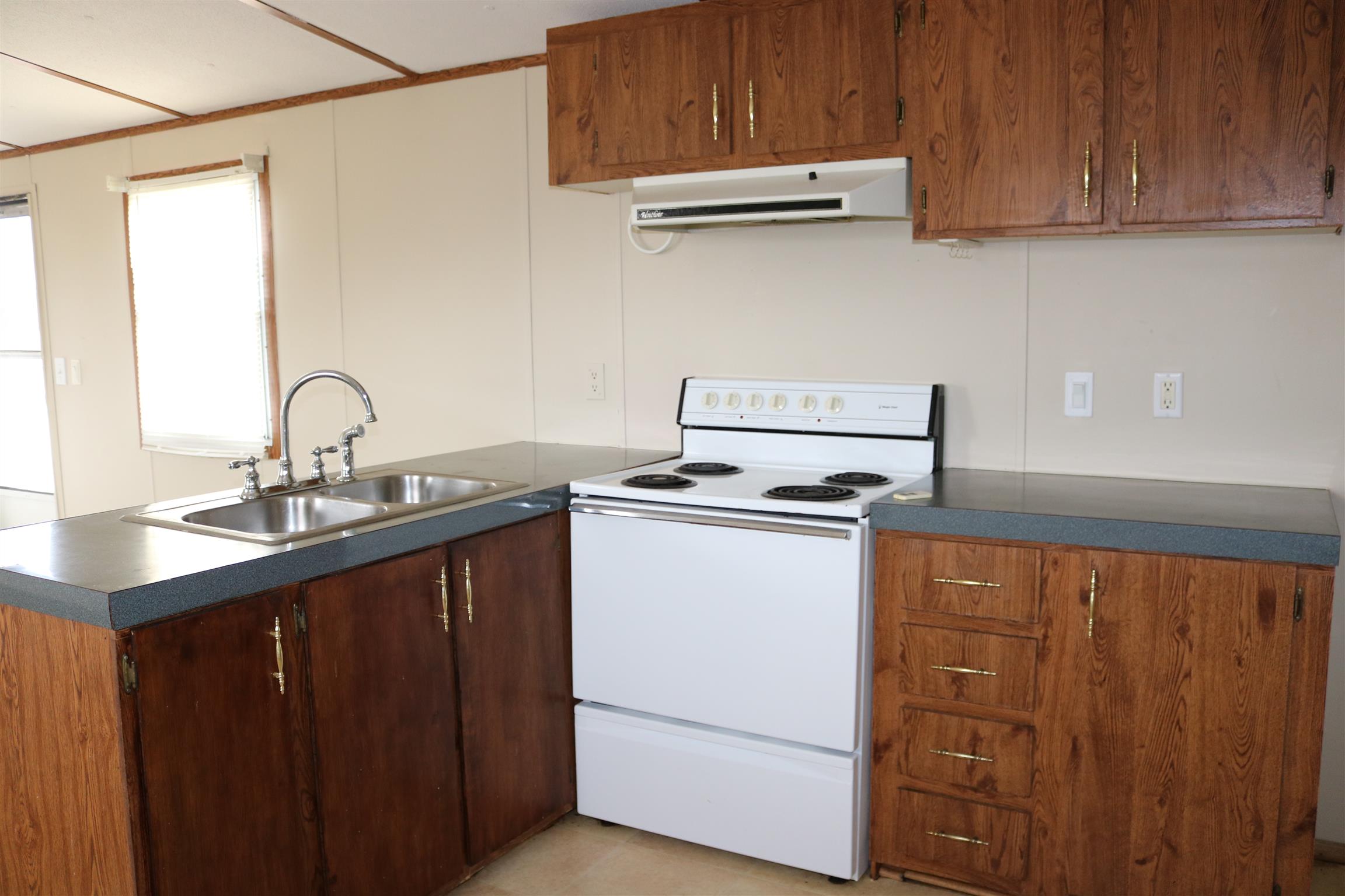 3963 Calista Road Cross Plains, TN 37049 - Photo 23 of 27 Kitchen comes with a stove and a sink, and even enough room for a refrigerator!