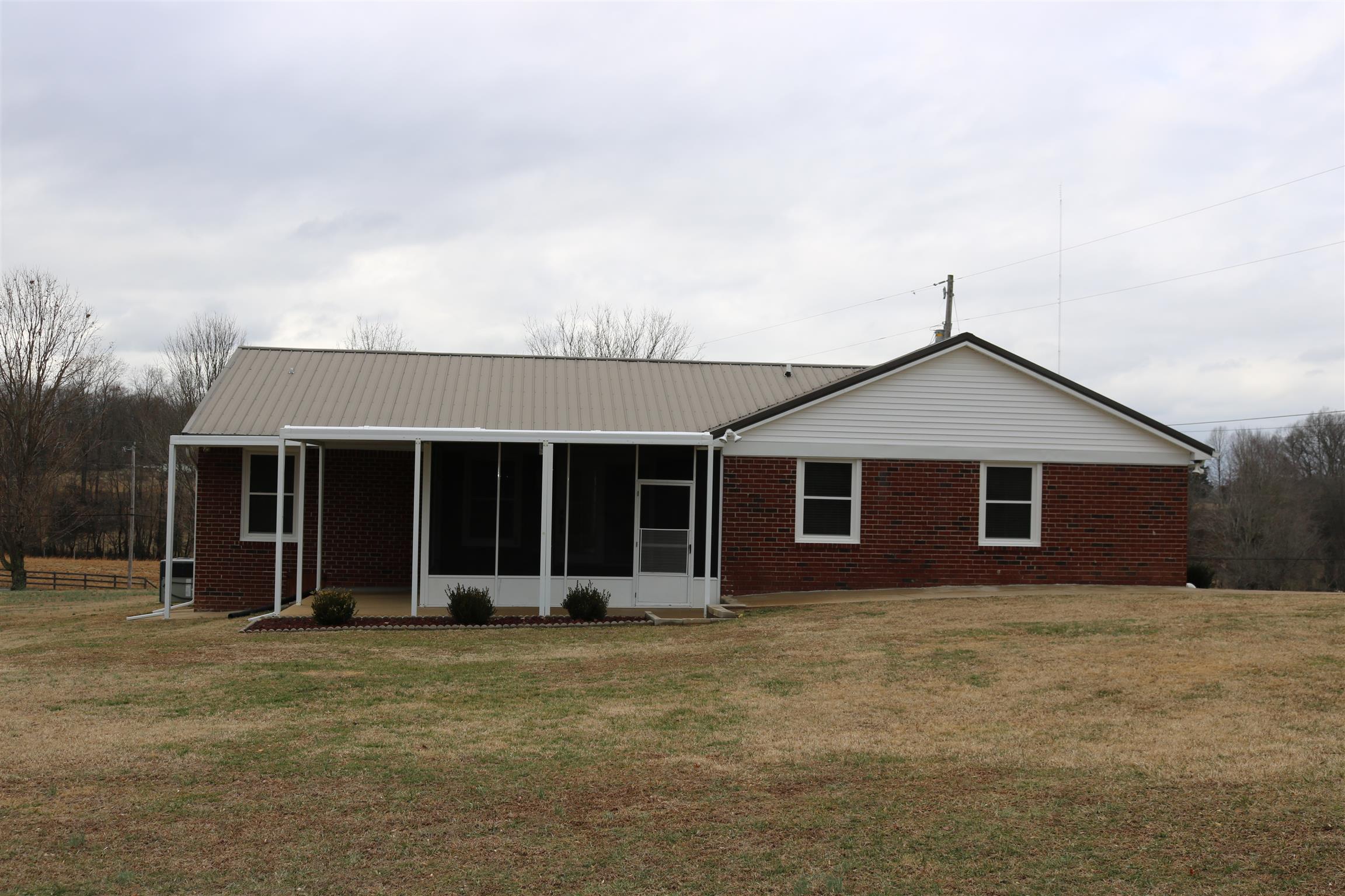 3963 Calista Road Cross Plains, TN 37049 - Photo 27 of 27 Great view of the back of the house at 3963 Calista Rd! Very solid brick home with a lot of space and 10 acres of beautiful land- you can't go wrong!