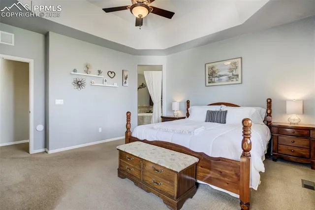 a bedroom with furniture and a chandelier