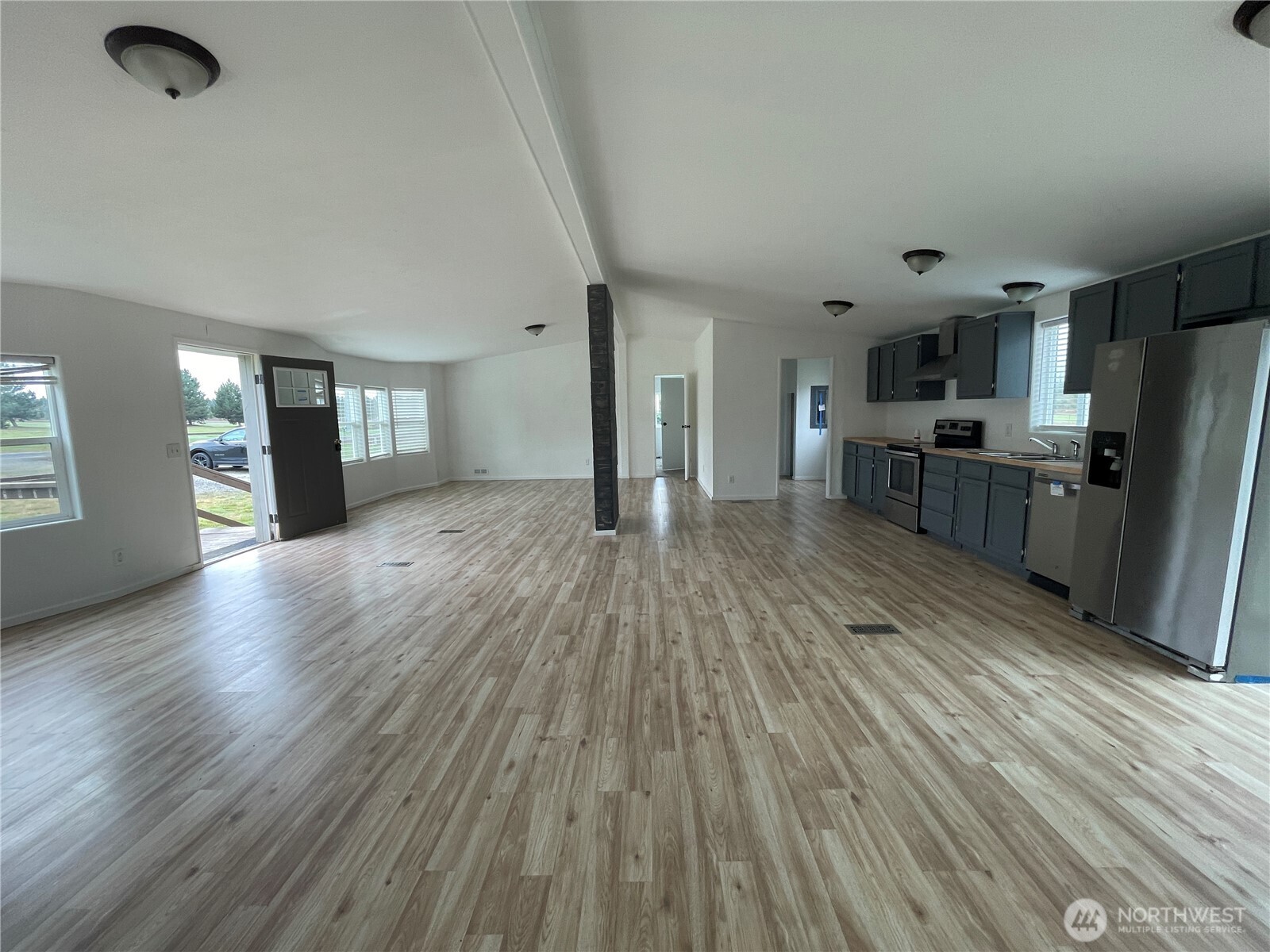 564 West Avery Road Winlock, WA 98596 - Photo 11 of 24 a view of a kitchen with a sink refrigerator and window