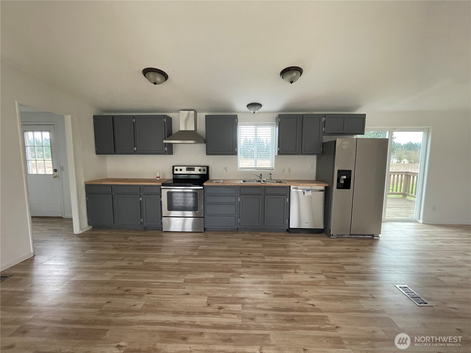 564 West Avery Road Winlock, WA 98596 - Photo 12 of 24 a kitchen with stainless steel appliances granite countertop a stove top oven and cabinets