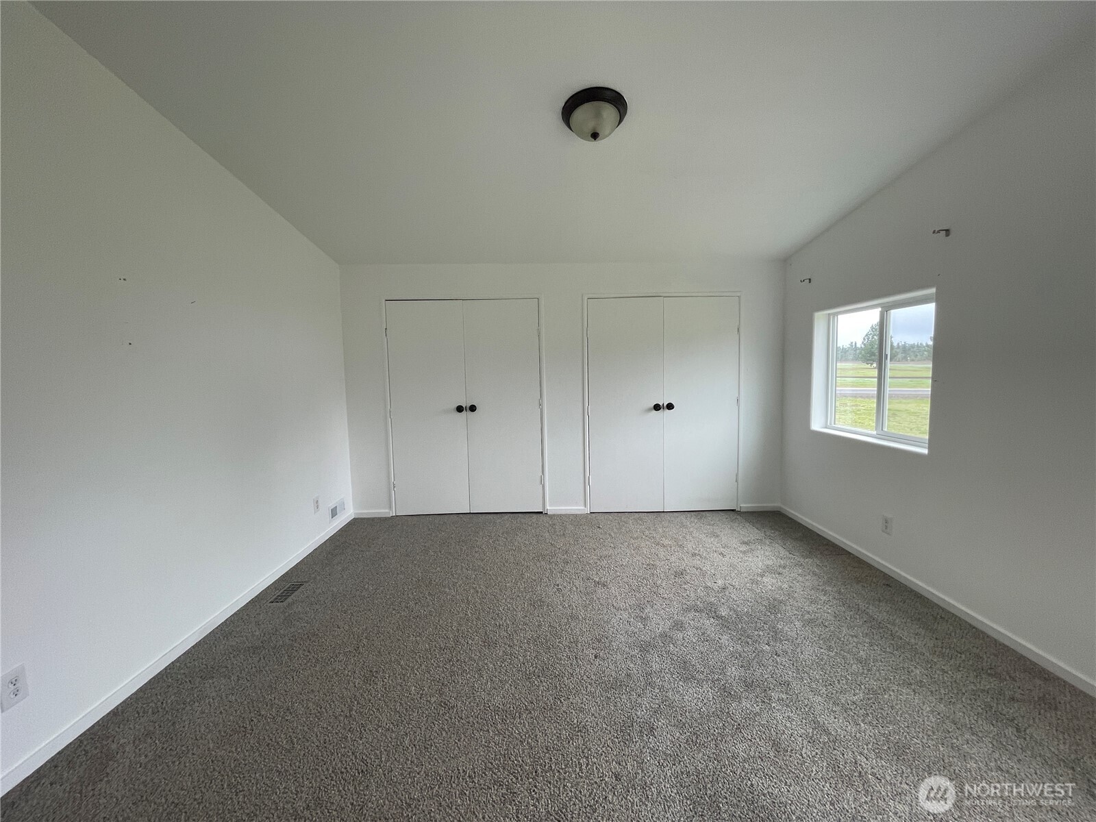 564 West Avery Road Winlock, WA 98596 - Photo 20 of 24 a view of an empty room with a window