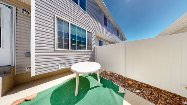 1674 Eastridge Road Price, UT 84501 - Photo 30 of 34 Private outdoor patio space featuring light gray siding and a white privacy fence