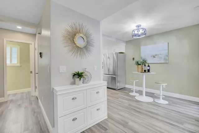a view of a dining room with wooden floor