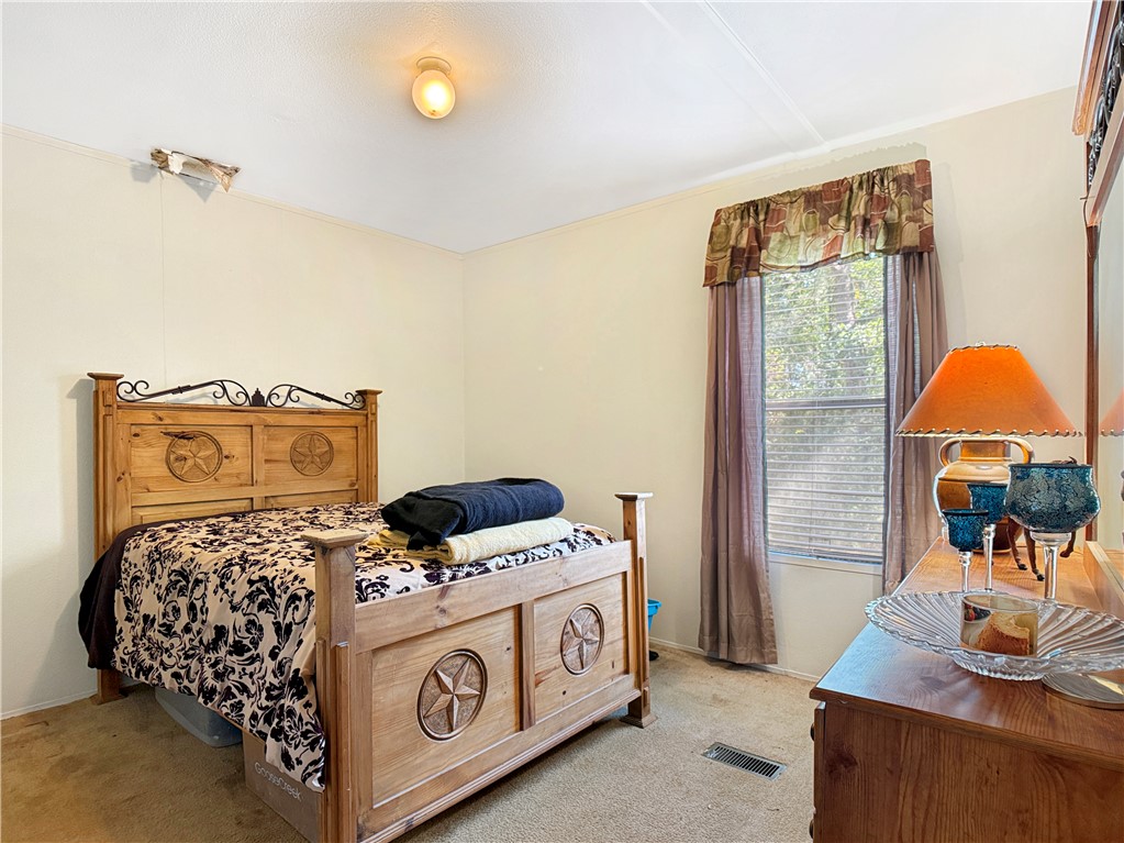10134 Cobb Branch Road Franklin, TX 77856 - Photo 17 of 23 Carpeted bedroom featuring baseboards